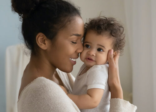 Photo of a woman holding her baby